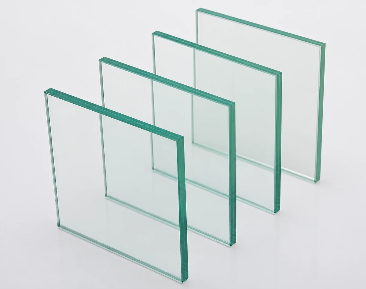 Four transparent glass panels with green edges